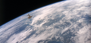 View of Mir Space Station, cloudy earth limb, STS-79